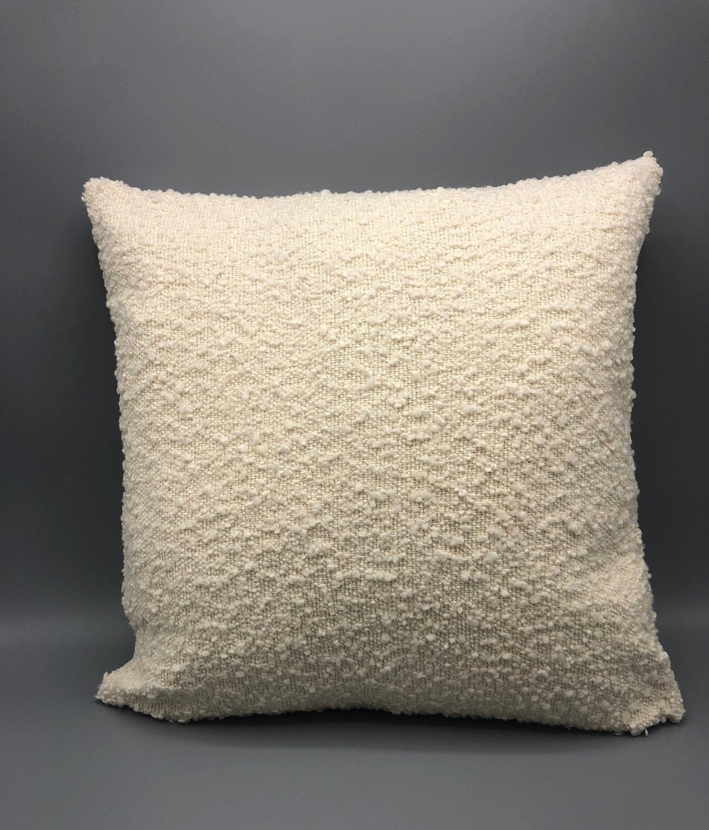 Handmade contemporary pillow with boucle cream fabric and cream vinyl in the back 17 x 17“ inches