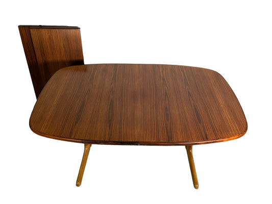 Mid-Century Ellipse shaped rosewood dining table with 2 leaves