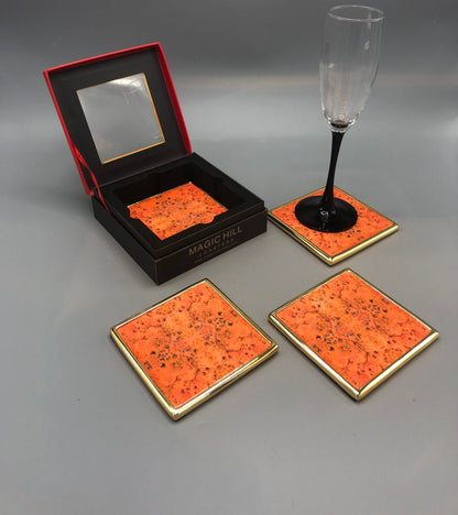 Handmade ceramic coasters with brass trim and velvet bottom. Art by Bruce Mishell