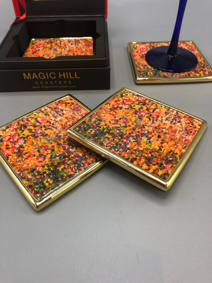 Handmade ceramic coasters with brass trim and velvet on the bottom. Art by Bruce Mishell