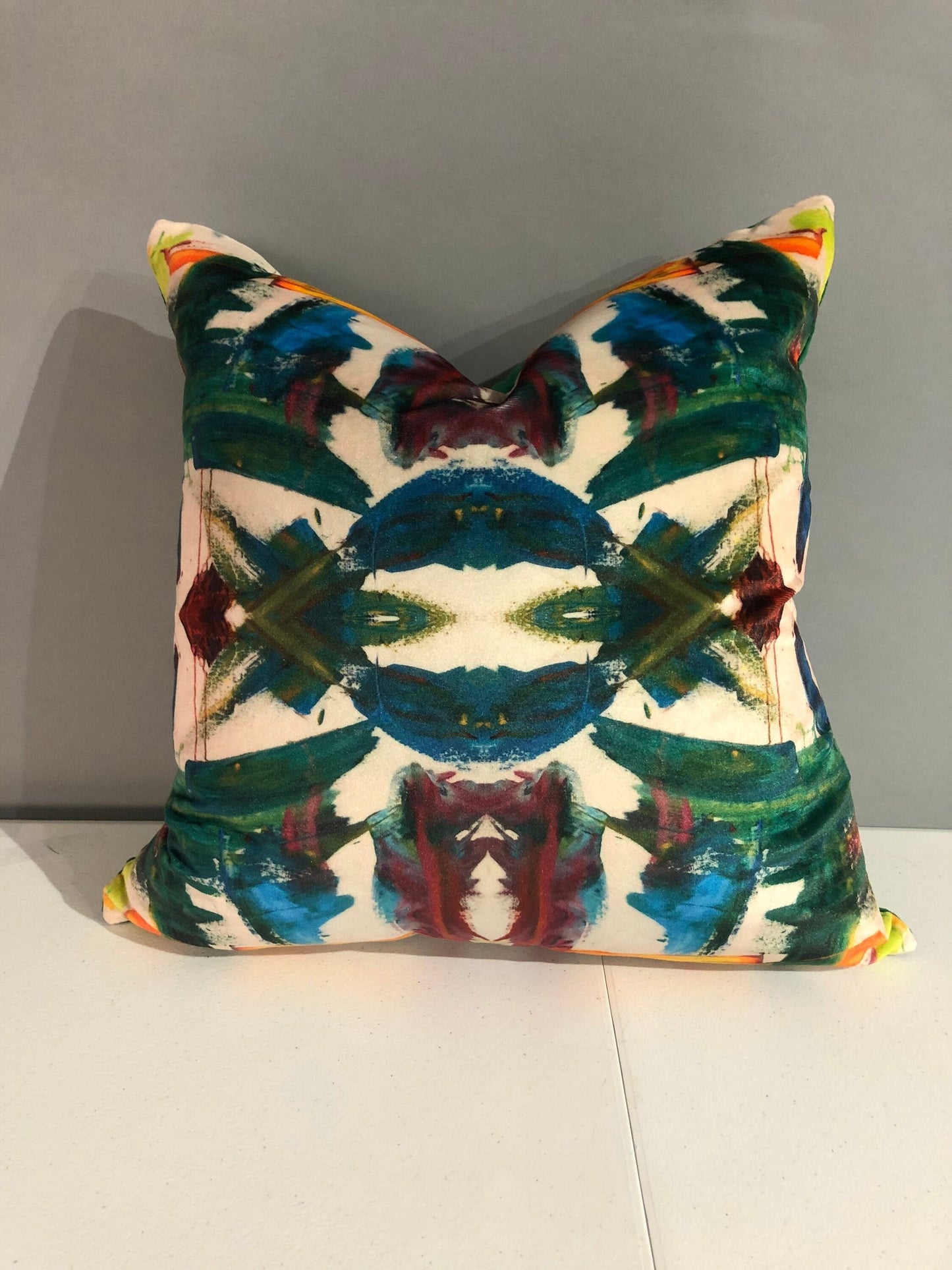 Contemporary abstract kaleidoscope pillows with print on velvet with green velvet in the back 16” x 16” inches