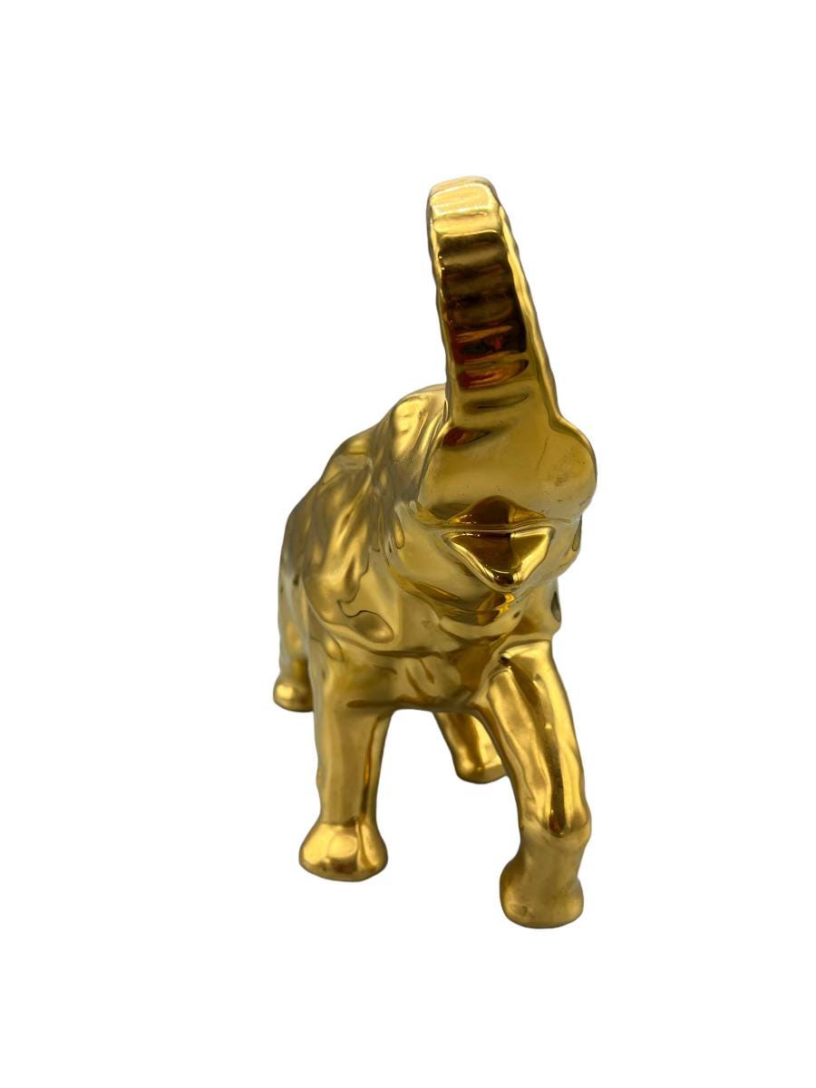 Decorative elephant figurine finished in a shiny gold color and symbolizing good luck