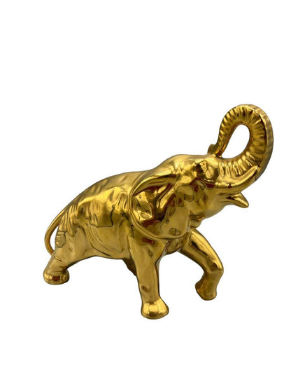 Decorative elephant figurine finished in a shiny gold color and symbolizing good luck