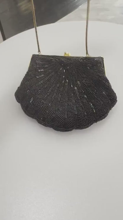 Vintage-inspired Carolyne Barton handbag in shell-like shape