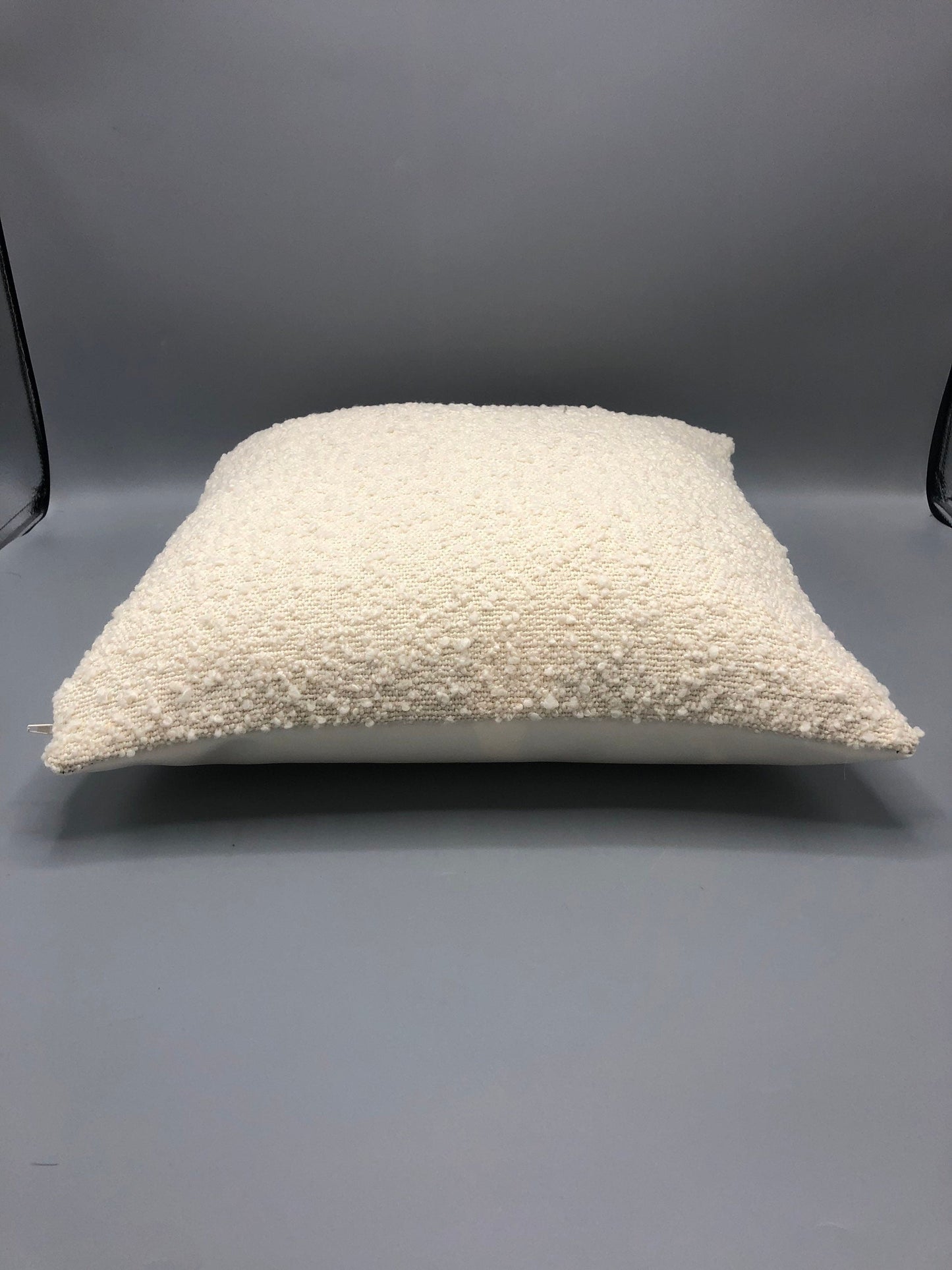 Handmade contemporary pillow with boucle cream fabric and cream vinyl in the back 17 x 17“ inches