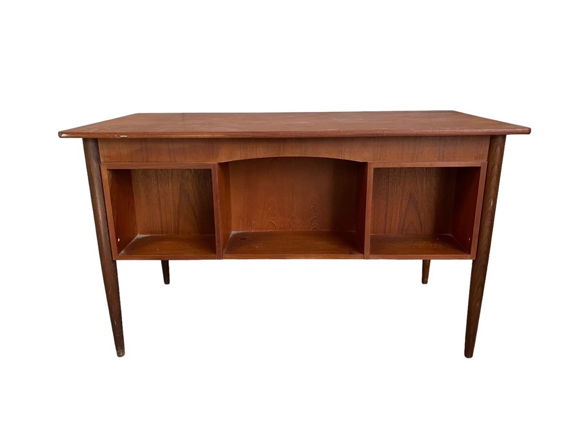 Mid-Century Teak desk with 6 drawers and library.